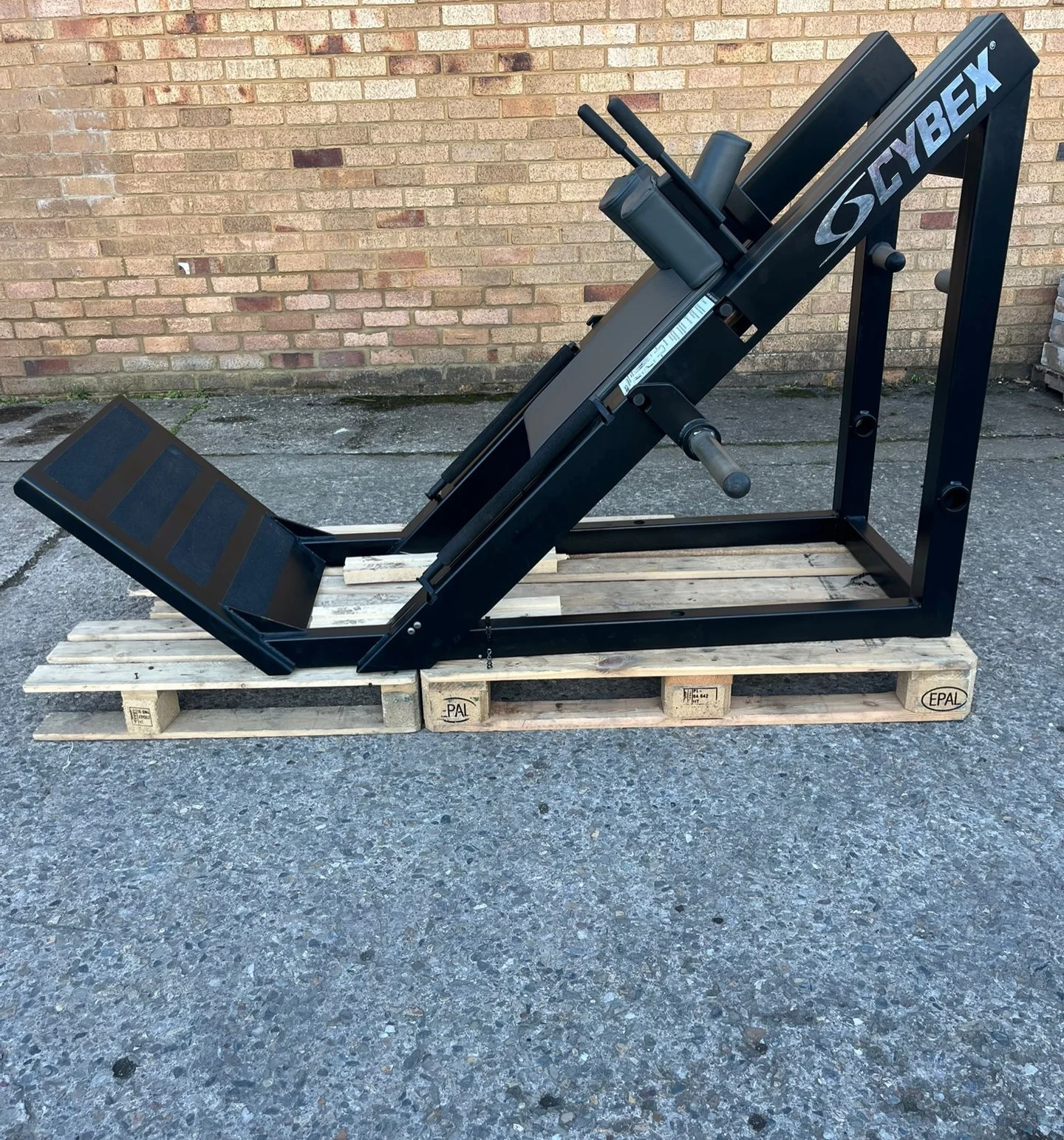 Cybex hack squat for sale, full side view on pallets